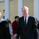 Mueller leaves St. John’s Episcopal Church on the morning of March 24, with wife, Ann.